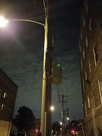 Low angle view of illuminated street light at night