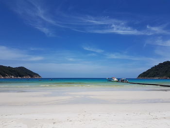 View of seascape against cloudy sky