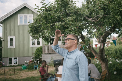 Man and woman standing in yard