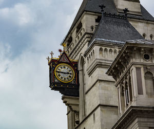 Low angle view of clock tower against sky