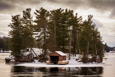 Scenic view of lake against sky during winter