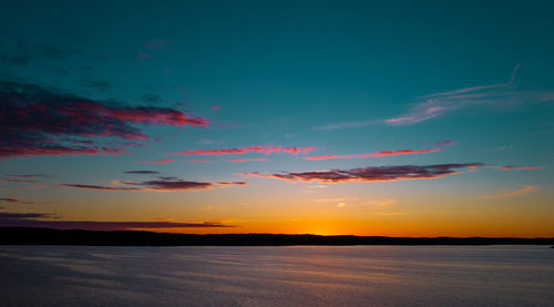 Scenic view of silhouette land against sky during sunset