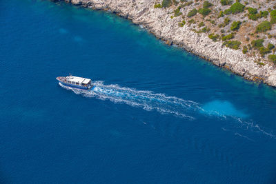Crossing boat on the blue waters of the mediterranean in the calanques national park