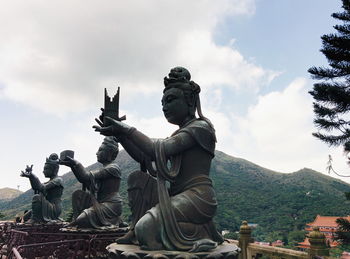 Low angle view of statue against sky