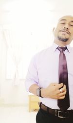 Portrait of businessman standing in office