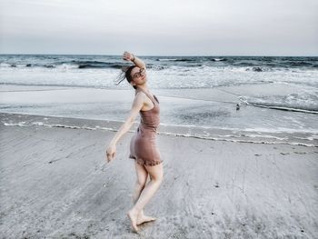 Woman standing on beach