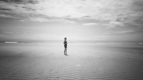 Full length of person standing on beach