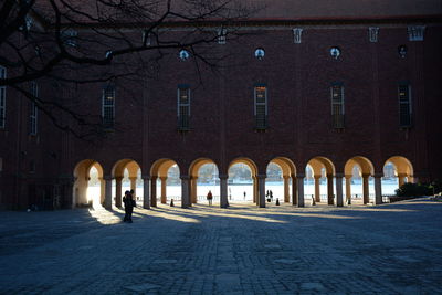 Footpath leading towards archways at city hall