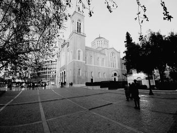 People walking in front of building