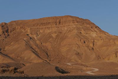 Scenic view of desert against clear sky