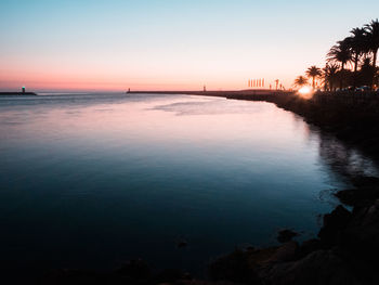 Scenic view of sea against sky at sunset