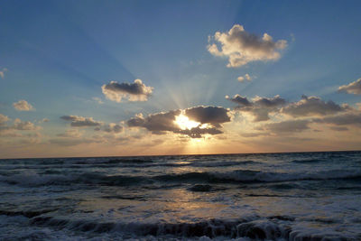 Scenic view of sea at sunset