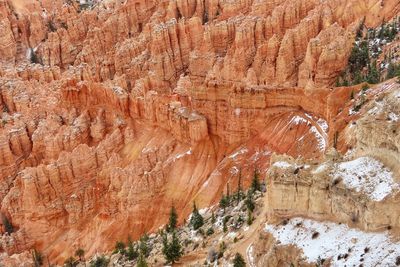 High angle landscape of orange and white hoodoos and spires in a valley