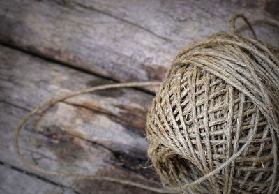 High angle view of rope ball on wooden table