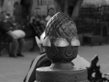 Close-up of statue against blurred water