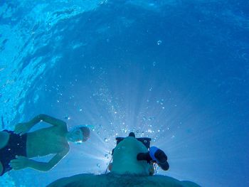 People swimming in sea