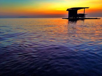 Scenic view of sea at sunset