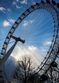 Low angle view of ferris wheel against sky