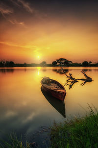 Scenic view of lake against sky during sunset