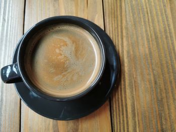 High angle view of coffee cup on table