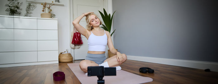 Young woman exercising in gym