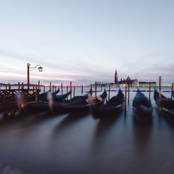 Boats moored in sea