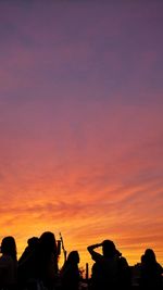 Silhouette of tourists at sunset