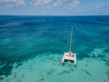 Sailboat on sea against sky