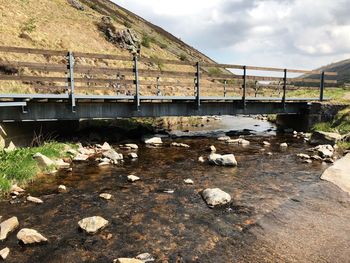 View of an abandoned car on rock