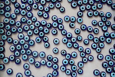 Full frame shot of blue beads on table
