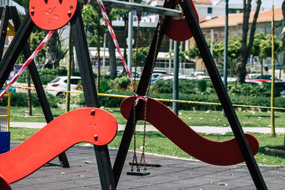 Close-up of empty swing in park