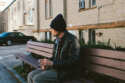 Man sitting in front of building