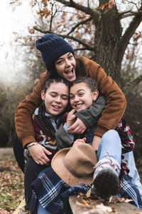 Rear view of smiling girl on tree