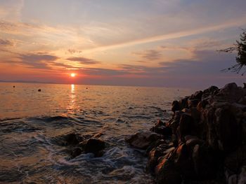 Scenic view of sea against sky during sunset