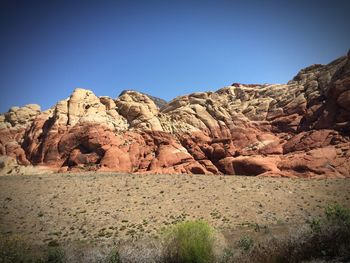 Rock formations in desert against clear sky