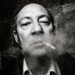 Portrait of man smoking cigarette