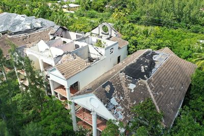 High angle view of trees and houses on field