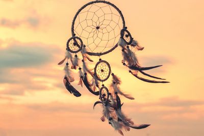 Close-up of dreamcatcher against sky