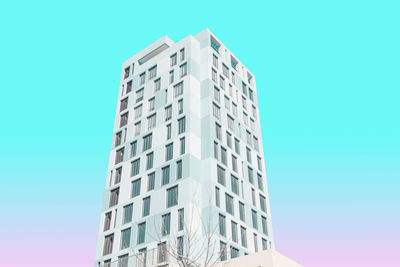 Low angle view of building against clear blue sky