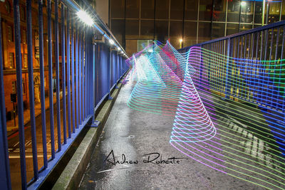 Multi colored light painting on wall at night