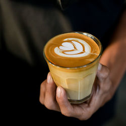 Close-up of hand holding coffee