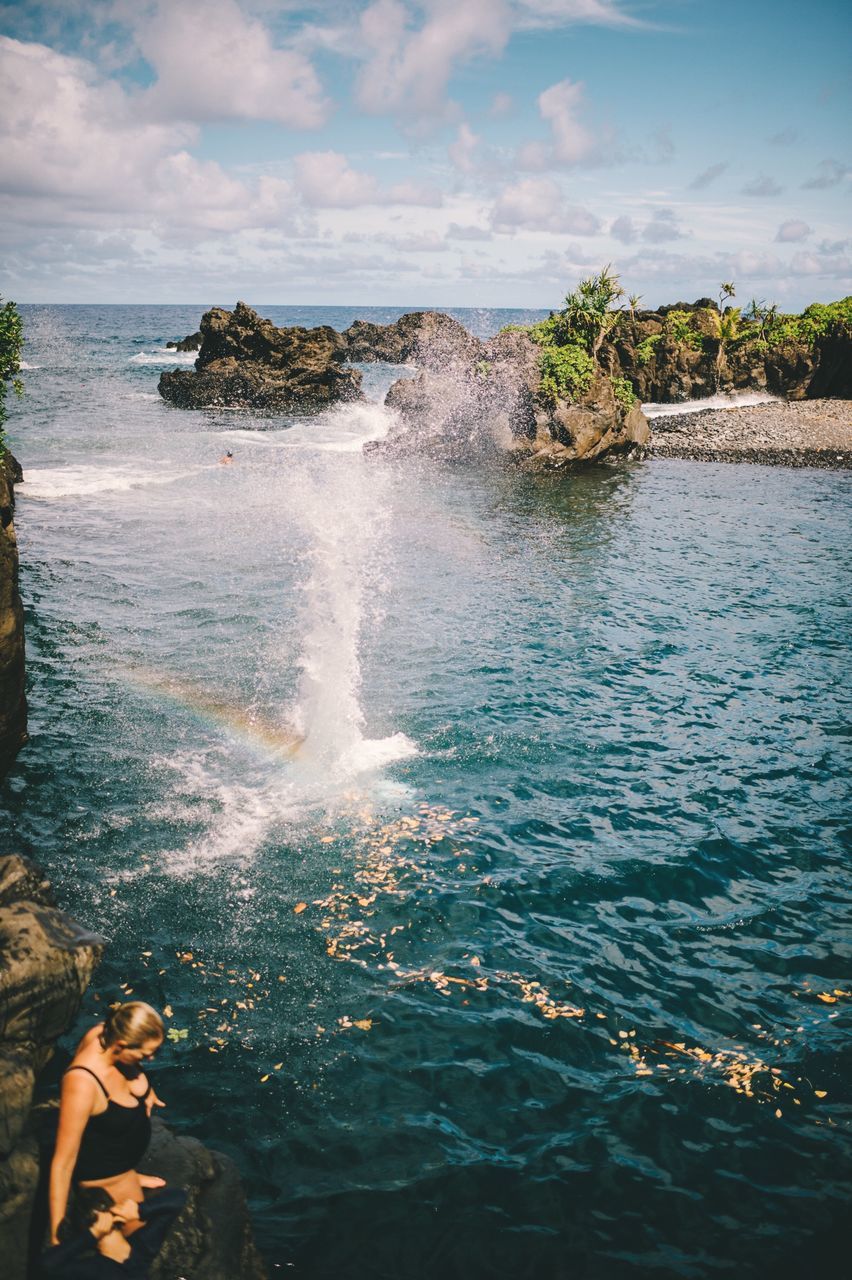 water, sea, beauty in nature, nature, sky, motion, real people, cloud - sky, lifestyles, scenics - nature, people, day, rock, leisure activity, solid, land, rock - object, outdoors