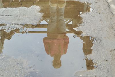 Reflection of sky in puddle