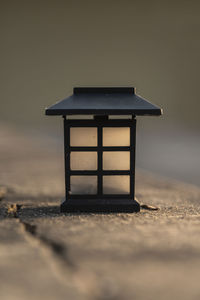 Close-up of table on beach against sky