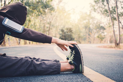 Man exercising on road