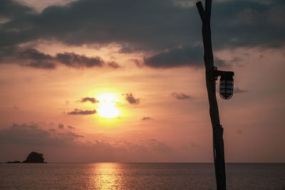 Scenic view of sea against orange sky