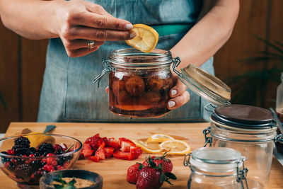 Midsection of man preparing food