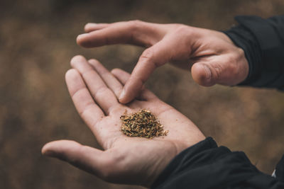 Close-up of man holding hands