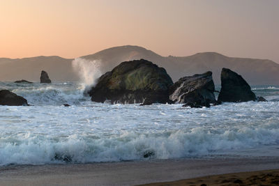 Scenic view of sea against sky during sunset