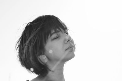 Close-up portrait of a girl over white background